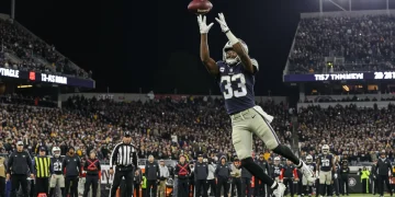 Rookie wide receiver making a game-winning catch in a 2024 NFL game.