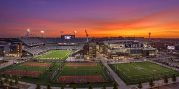 Futuristic college sports complex with stadium and arenas