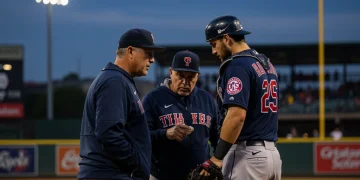 Manager, catcher, and pitcher in a strategic mound huddle during an MLB game.