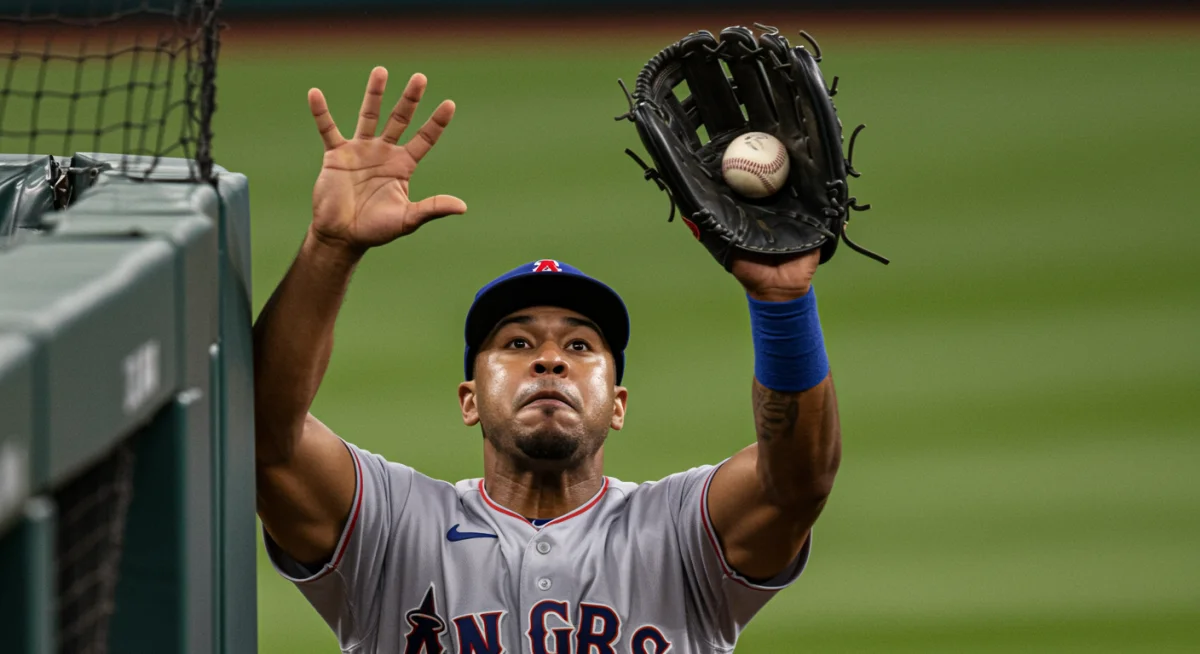 Outfielder robbing a home run at the wall