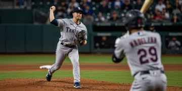 Bullpen Battleground: 3 Relievers Dominate Critical 2025 MLB Innings Reliever pitching intensely in a critical 2025 MLB game, stadium lights in background