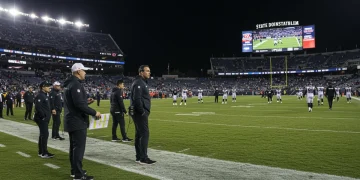 NFL coach making a critical decision during a tense, late 2024 game