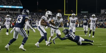 Dynamic NFL kick returner evading defenders on a special teams play during the 2024 season.