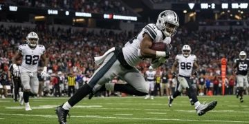 Dynamic shot of an unsung NFL player making a crucial play in a stadium