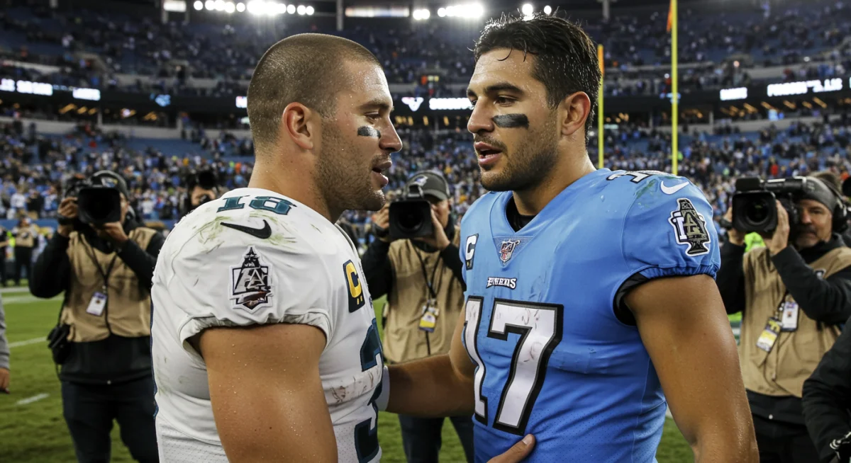 Rival NFL players showing sportsmanship after a 2024 playoff game, highlighting the human element beyond competition.