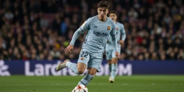 Dynamic young La Liga player dribbling on field