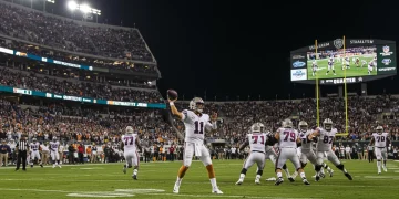 Dynamic NFL stadium scene with quarterback throwing a game-changing pass