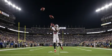Unpacking the Top 5 NFL Highlight Plays from 2026 Preseason Week 1 Dynamic NFL player making a spectacular catch during a 2026 preseason game under stadium lights.