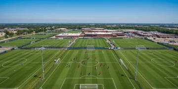 Aerial view of a top youth soccer academy in the US, showing multiple training fields and modern facilities.